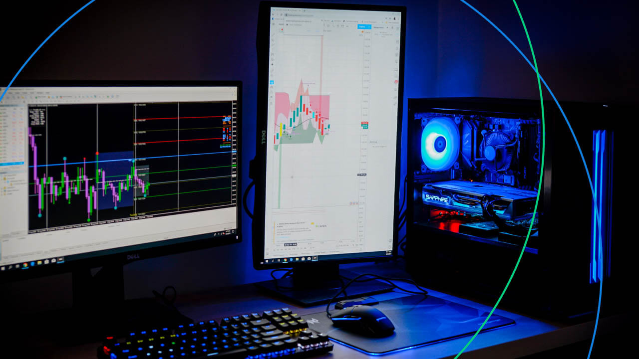 How to Open a MetaTrader 5 Account with dual computer monitors displaying forex trading charts in a gaming PC setup.