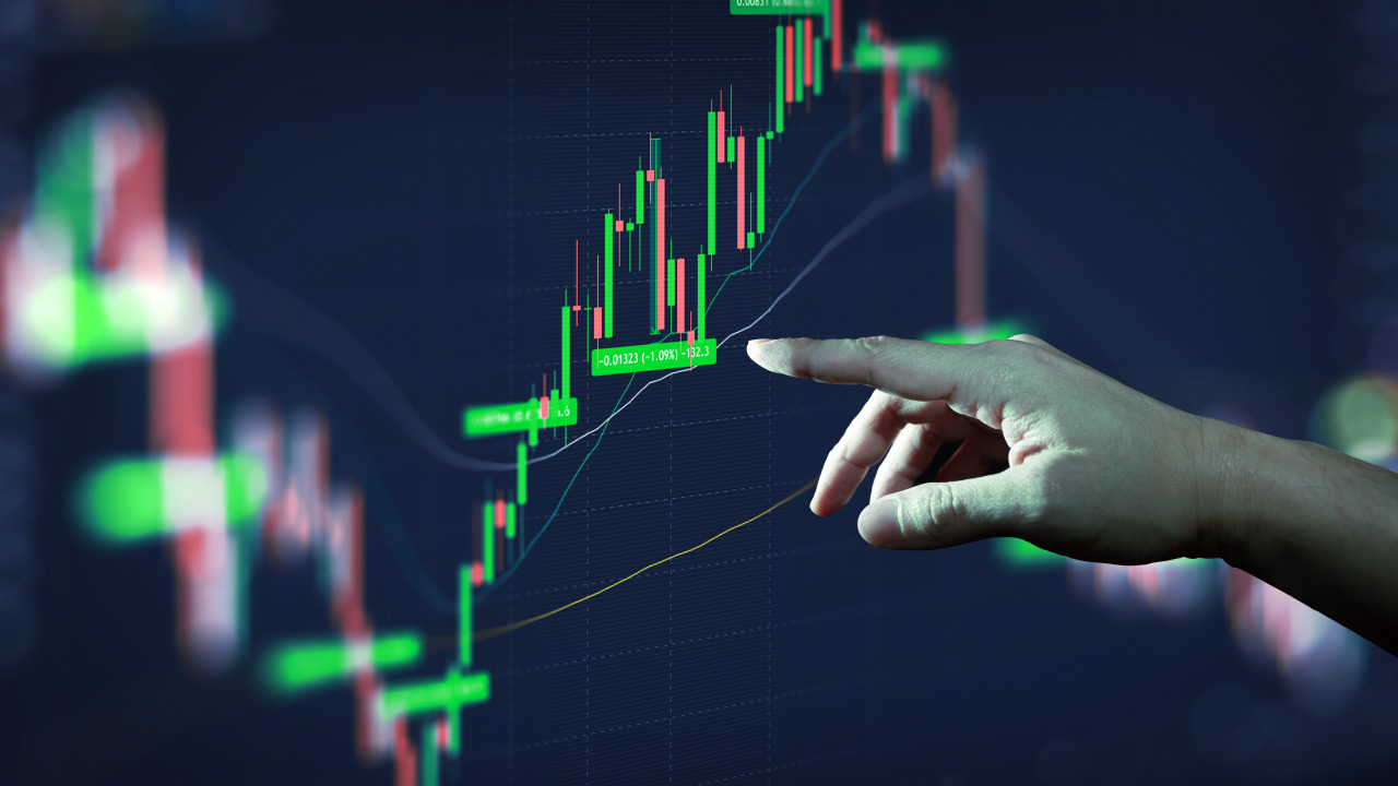 Hand pointing at a digital forex trading chart showing green candlesticks and profit percentage labels during an upward trend.