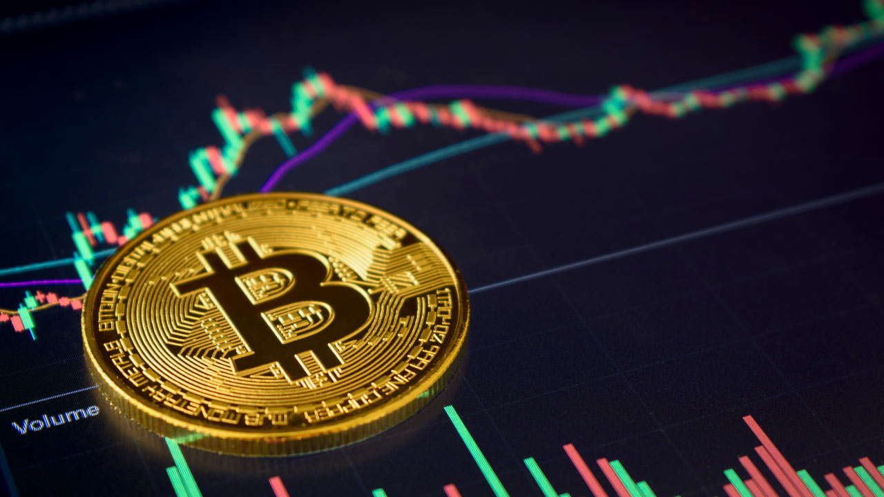 A golden Bitcoin coin placed on a digital trading chart displaying candlestick patterns and technical analysis, representing the use of top trading indicators in crypto trading.